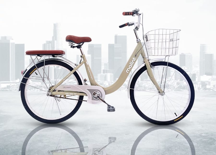 City Ride in cream, against a city skyline