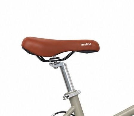 Brown saddle with the malint mark, on a silver seatpost
