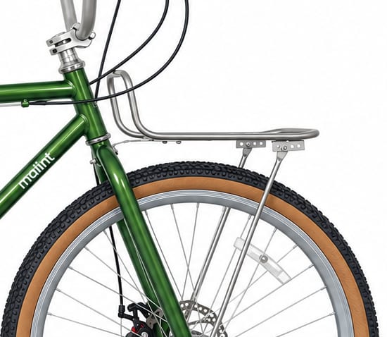 Polished front carrier rack above the front wheel