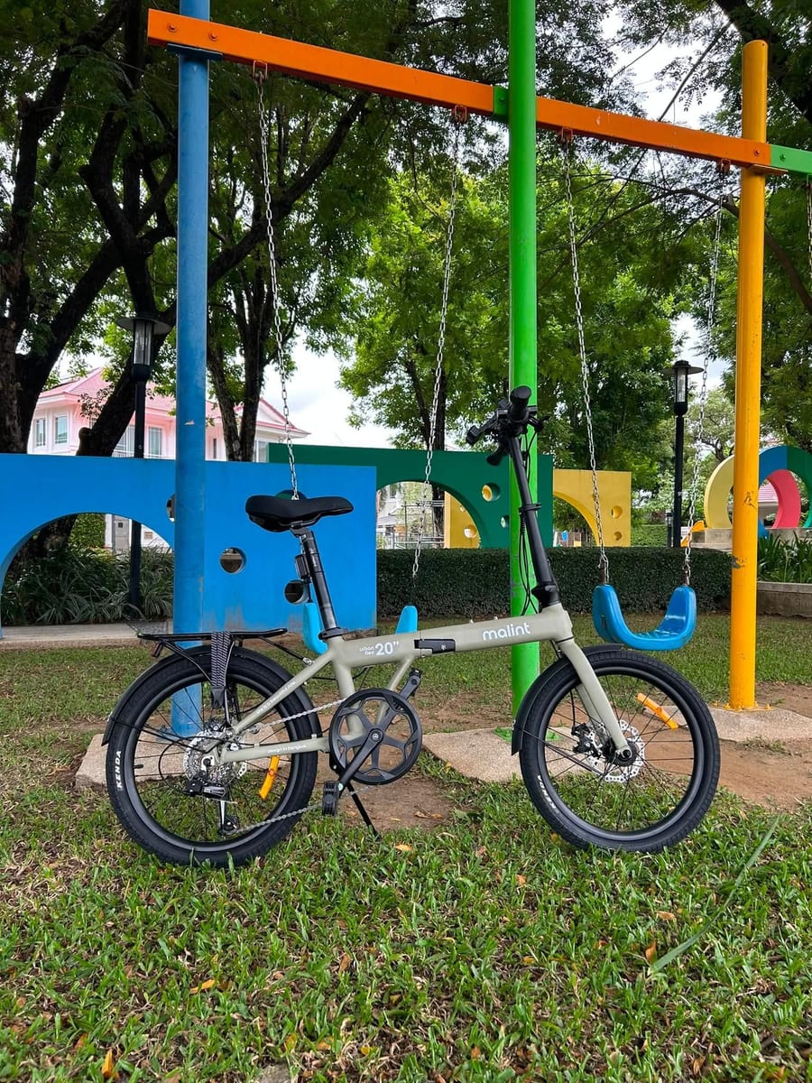 A City Flex parked beside a playground swing