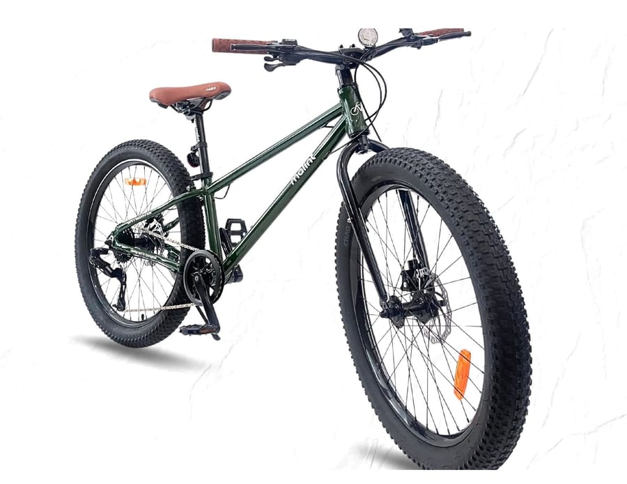 Rocket in green from the front three-quarter, showing the 3.0 inch tyres